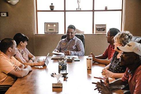 Group of people meeting around a table